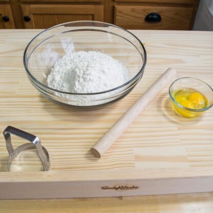 Rolling pin on table with other ingredients